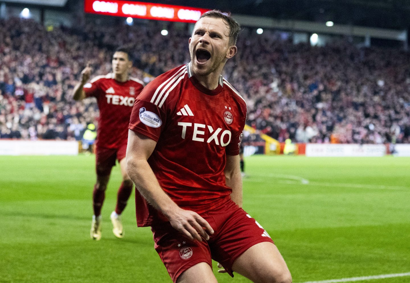 Aberdeen's Nicky Devlin celebrates scoring to make it 1-0 against Rangers. Image: SNS