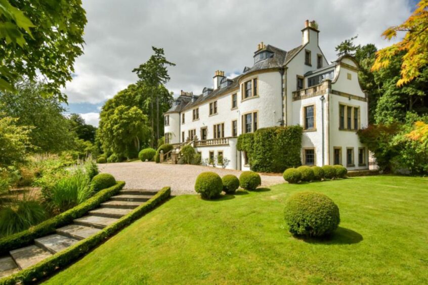 The white walls of the mansion make it a standout during the summer sunshine. 