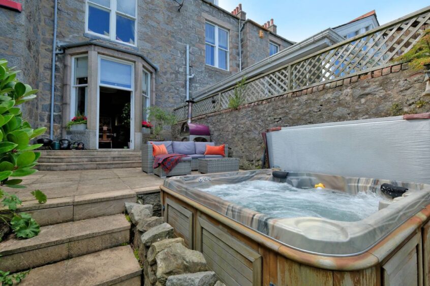 The hot tub is in a secluded spot within the garden grounds, Image: Ledingham Chalmers Estate Agency 