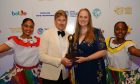 Glen Mhor co-owner Victoria Erasmus collects the prize from Justin Cooke, executive vice president of World Sustainable Travel and Hospitality Awards in Belize. Image: Heartland Media