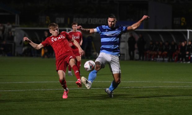 Ross Still, right, heads home Huntly's second goal in their Evening Express Aberdeenshire Cup semi-final win against Buckie Thistle. Pictures by Kenny Elrick/DCT Media.