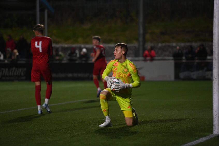 Aberdeen goalkeeper Rodrigo Vitols holding the ball and looking down the pitch in the Banks o' Dee v Aberdeen B at Spain Park in the semi-final of the Evening Express Aberdeenshire Cup on Wednesday October 2 2024. Image: Darrell Benns/DC Thomson.