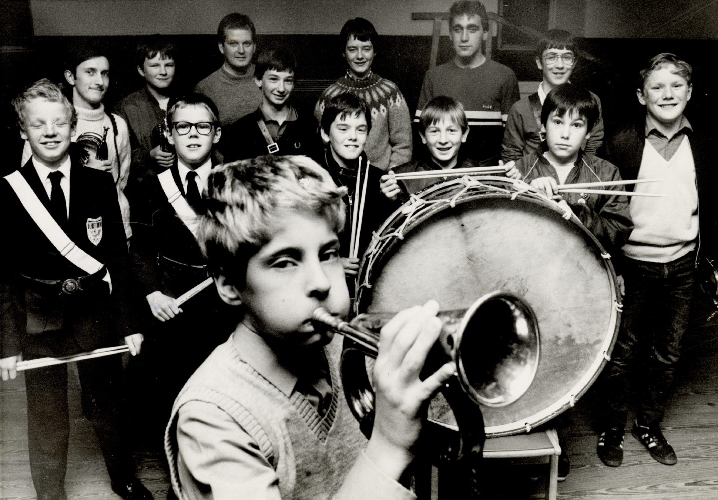 Image shows members of the Boys' Brigade bugle band in 1983, some are holding their musical instruments