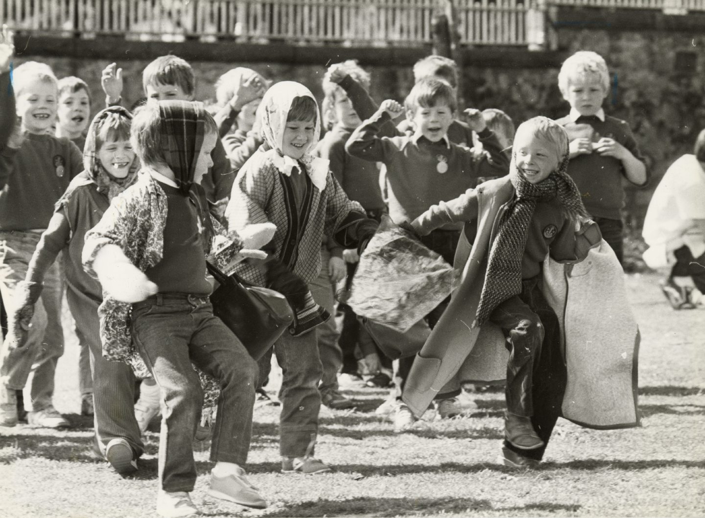 Image shows a group of young boys running and having fun in a fancy dress raceFeatured E.E. 27/05/86