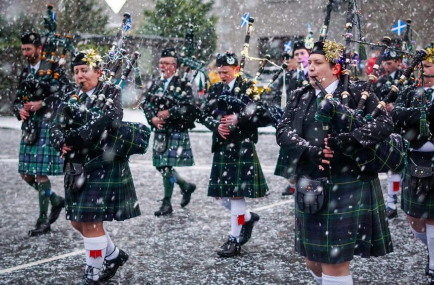 Pipe band playing in the snow