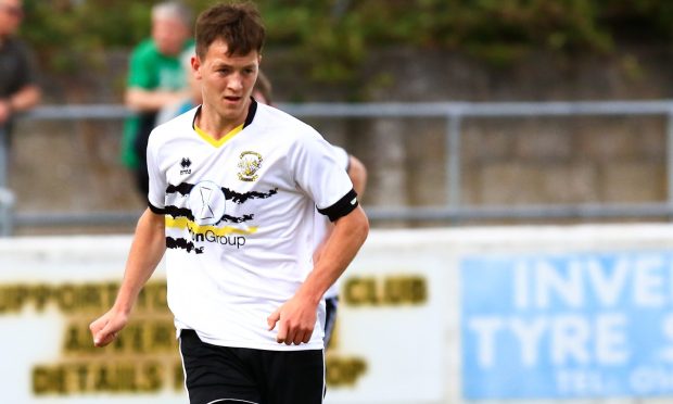 Clachnacuddin FC's No18 Alasdair Gillies on the ball