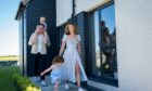 couple with two children enter their new home in Aberdeenshire