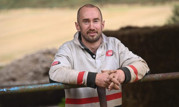 Duncan Maclennan at the farm he works on near Ellon. The 29-year-old is on the path to recovery after a suicide attempt two years ago. Image: Darrell Benns/DC Thomson