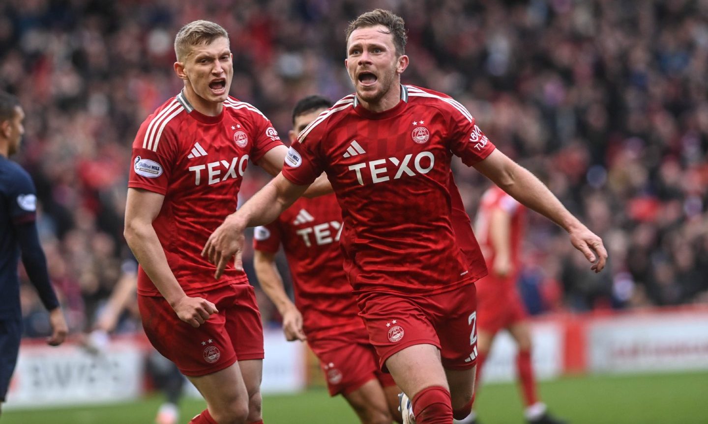 CR0050267. Story by Sean Wallace / Sport. Pittodrie Stadium, Aberdeen. Scottish Premiership - Aberdeen FC v Heart of Midlothian. Pictured is Aberdeen's Nicky Devlin celebrating after scoring to make it 2-2. Sunday 6th October 2024. Image: Darrell Benns/DC Thomson.