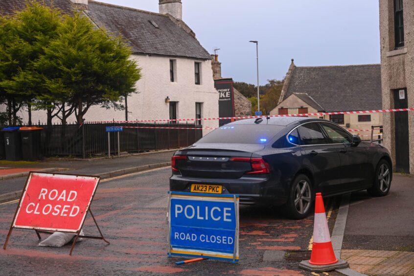 Road closed sign.