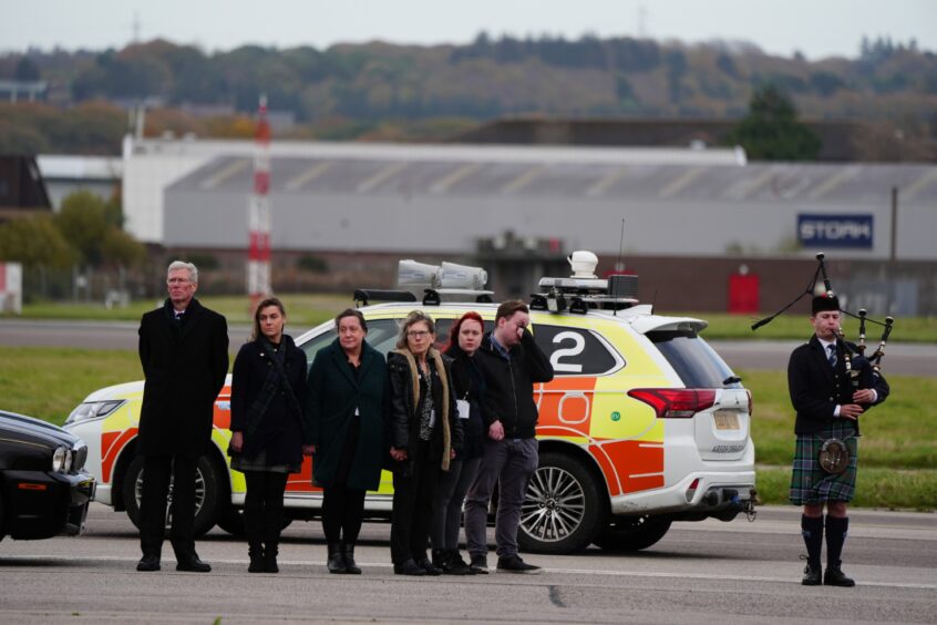 Alex Salmond coffin arriving at Aberdeen International Airport.