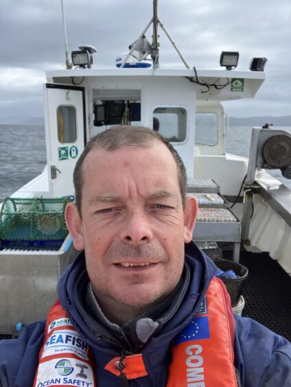 Iain on his fishing boat. 