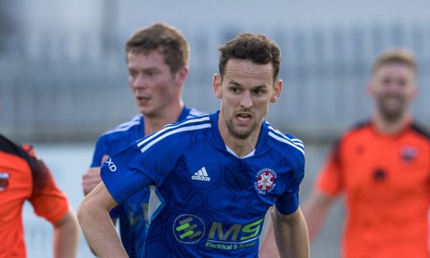 Michael Philipson, centre, celebrates scoring Banks o' Dee's fourth goal in the Evening Express Aberdeenshire Cup win against Aberdeen. Pictures by Darrell Benns/DCT Media.