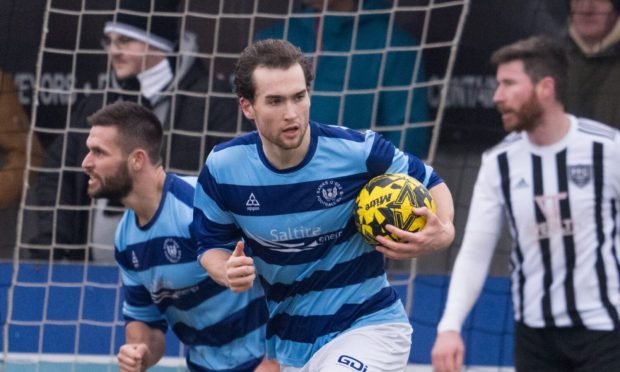 9 March 2024. Bellslea Park, Seaforth Street, Fraserburgh. This is from the Breedon Highland League Football Match between Fraserburgh FC and Banks O' Dee FC. PICTURE CONTENT:   Banks o' Dee's Jevan Anderson (ball in hand), after scoring                                                             CREDIT: Jasperimage