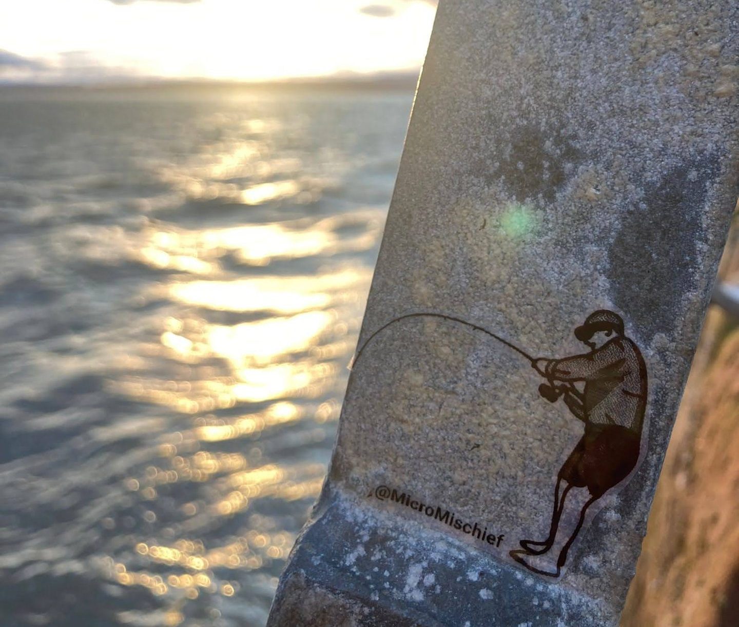 A 4cm-high fisherman appears to cast a line into a vast body of water. Image: MicroMischief.