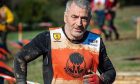 James Brown running in a numbered bib at World's Toughest Mudder 2018