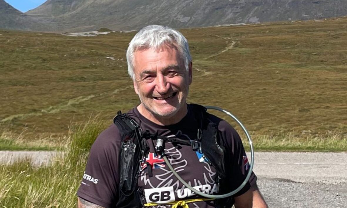 James Brown pictured with the hills in the background during a hill run.