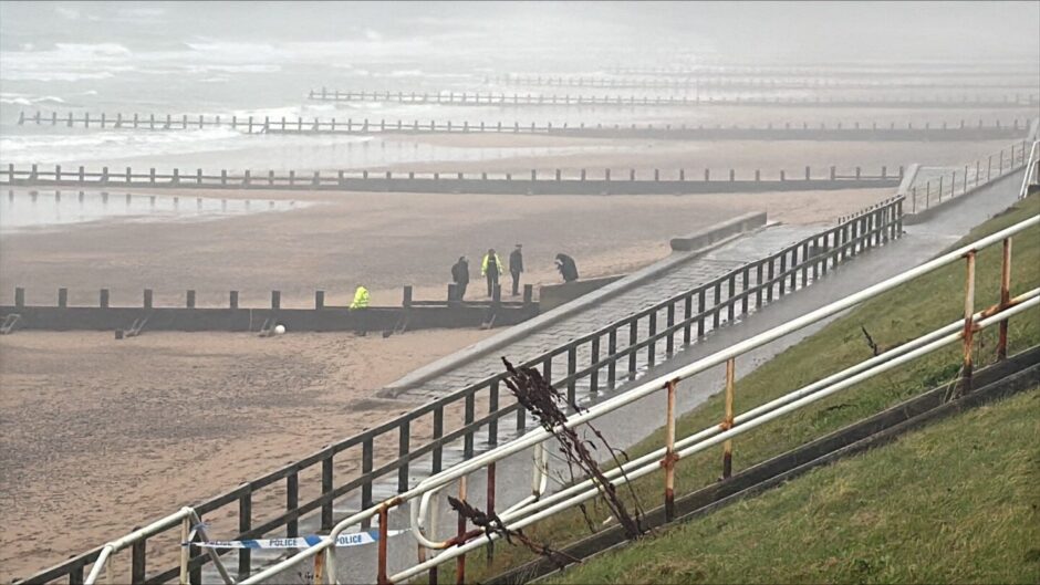 Police are focused on an area on the beach