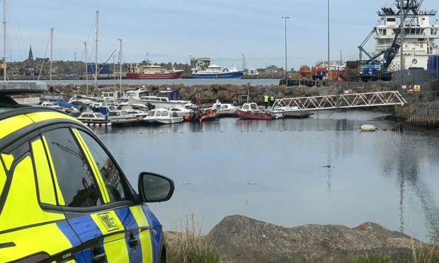 Police at Peterhead Bay Marina. Image: Isaac Buchan/ DC Thomson