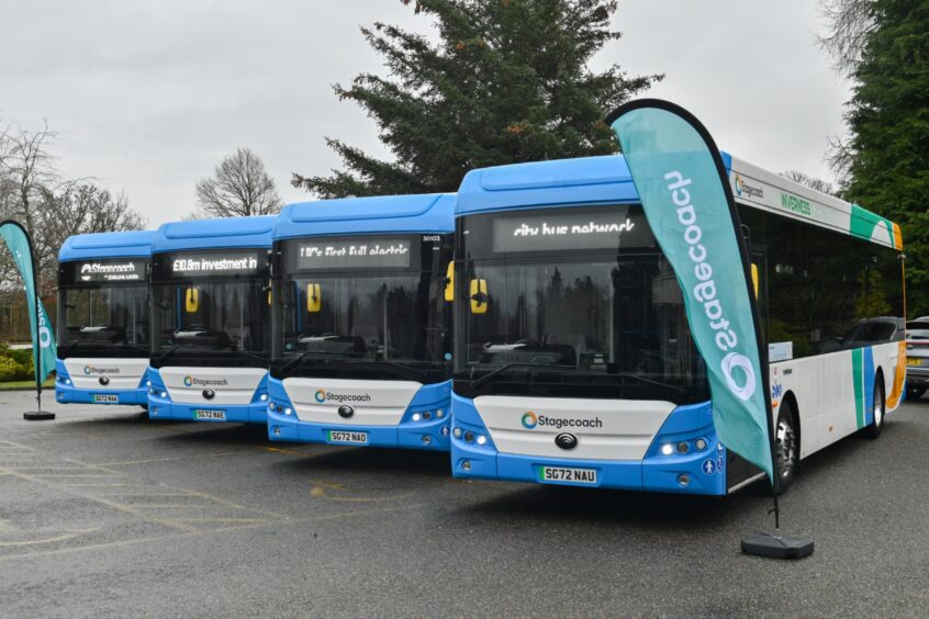 Three blue Stagecoach buses lined up side by side. 