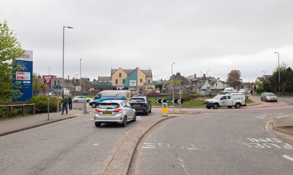 Traffic joining A96 from Tesco. 