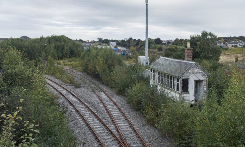 Signal box next to railway. 