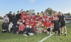 The Brora Rangers players and coaching staff celebrate their final victory with the North of Scotland Cup trophy. Pictures by Jason Hedges/DCT Media.