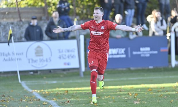 Shane Sutherland celebrates scoring for Brora Rangers in their North of Scotland Cup final triumph against Clachnacuddin. Pictures by Jason Hedges/DCT Media.