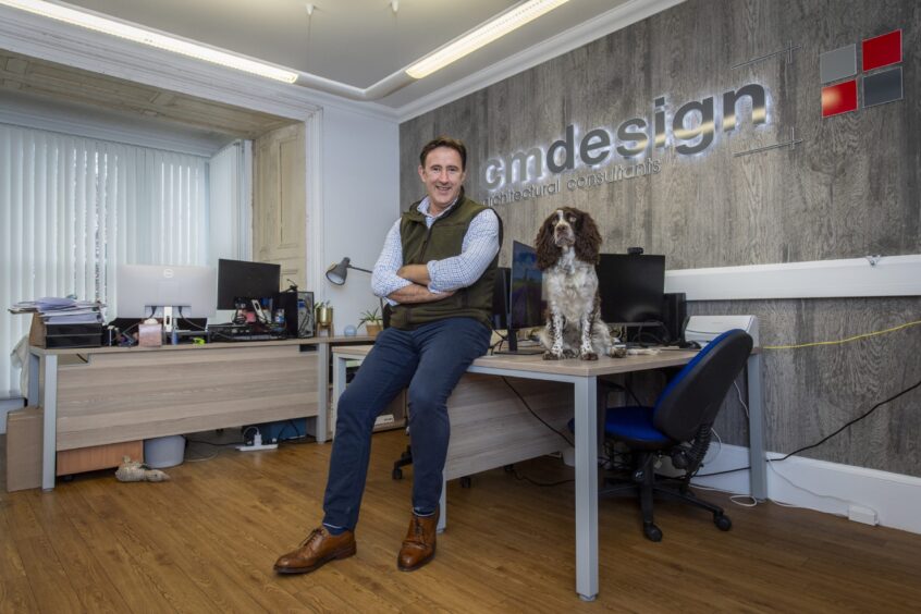 CM Designs is owned by Craig Mackay pictured with dog Jura.