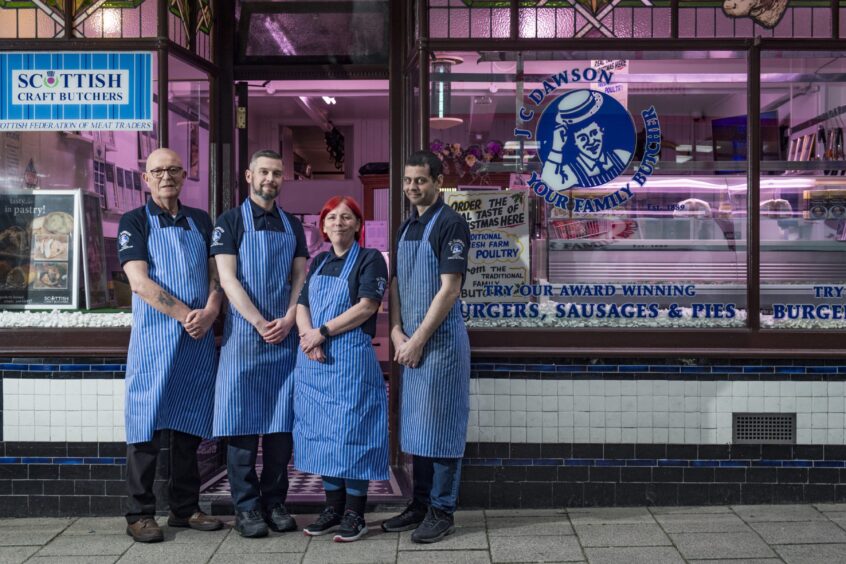 Michael Dawson and team outside butcher. 