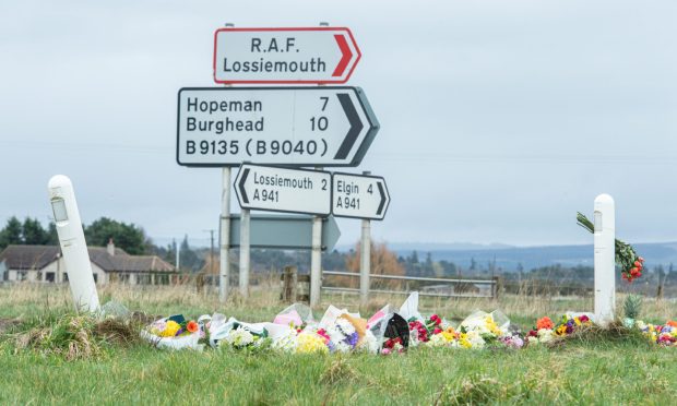 Flowers laid at the A941/B9135 junction where two teens were killed earlier this year. Image: DC Thomson.