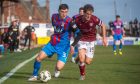 Charlie Reilly, left, takes on Arbroath's Brynn Sinclair. Image: Kath Flannery/DC Thomson