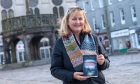 Nicky Young at the Castlegate with her debut novel. Image: Kath Flannery/DC Thomson