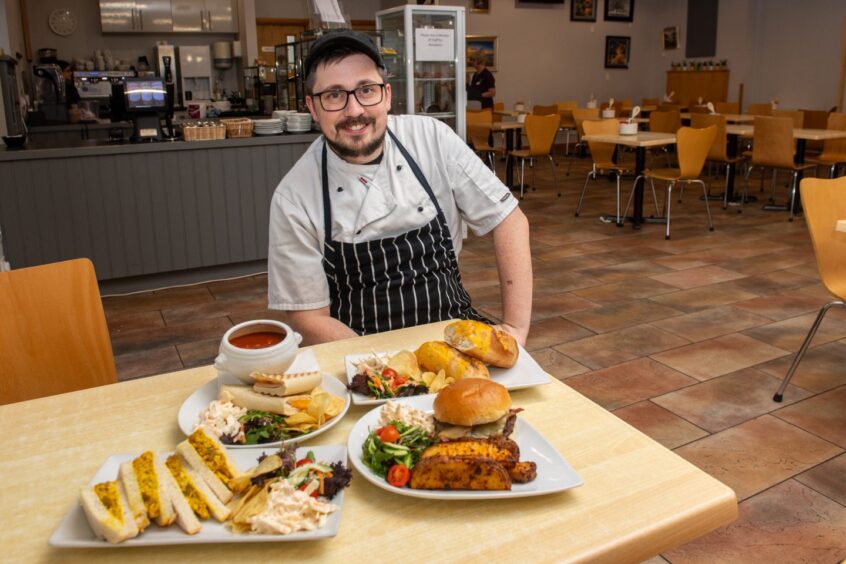 Matty the chef with a table of his dishes