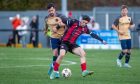 Jay Halliday, right, of Inverurie Locos holds of Dundee North End's Brian Clark.