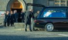 Moira Salmond (second left) leaves the funeral service for her husband former first minister of Scotland Alex Salmond, at Strichen Parish Church. Image: Kath Flannery/DC Thomson.