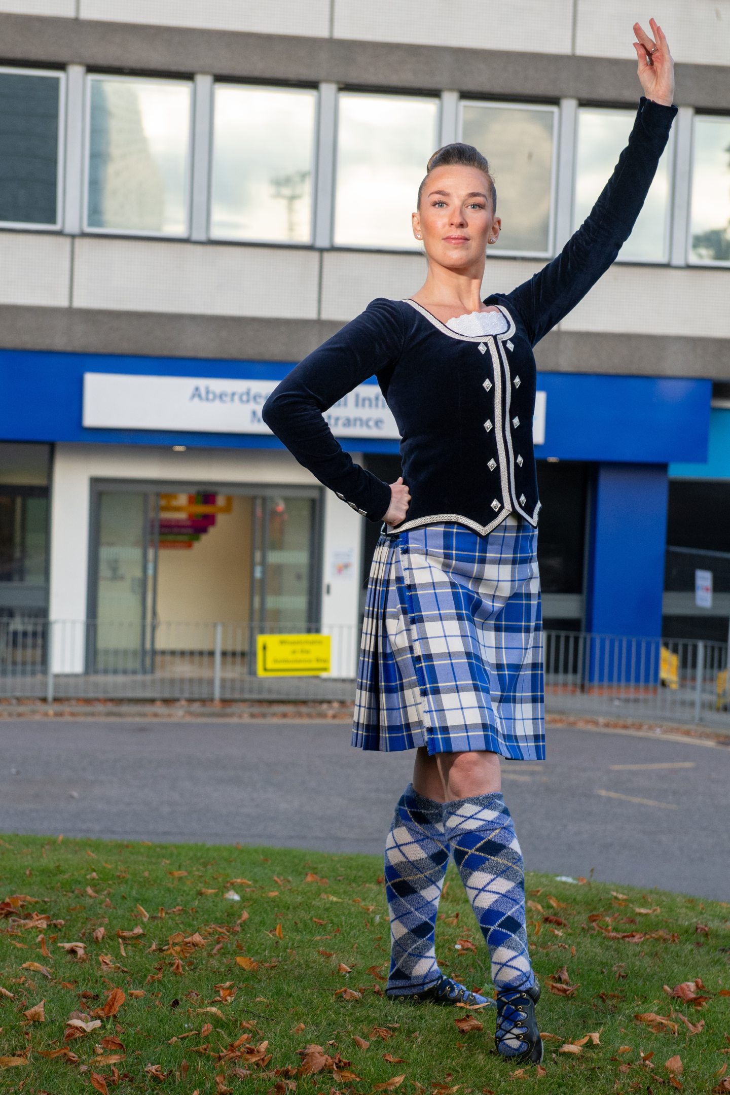 Rebecca Thow outside ARI in Aberdeen in a dance pose. 