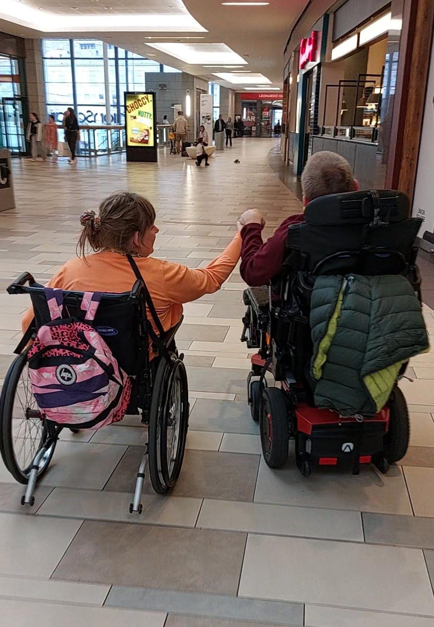 Lindsay and Maurice holding hands