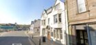 New signs have gone up in the hotel's window advertising its sale. Image: Google Maps