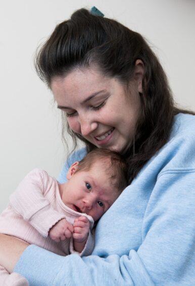 A quiet moment as mum and daughter share a cuddle.