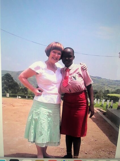 Marlyn Somers and Beatrice Tumusiime in her school uniform age 12