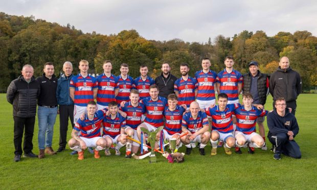 Kingussie pictured with both the Mowi Premiership Trophy and the MOD Cup. Image: Neil G Paterson.