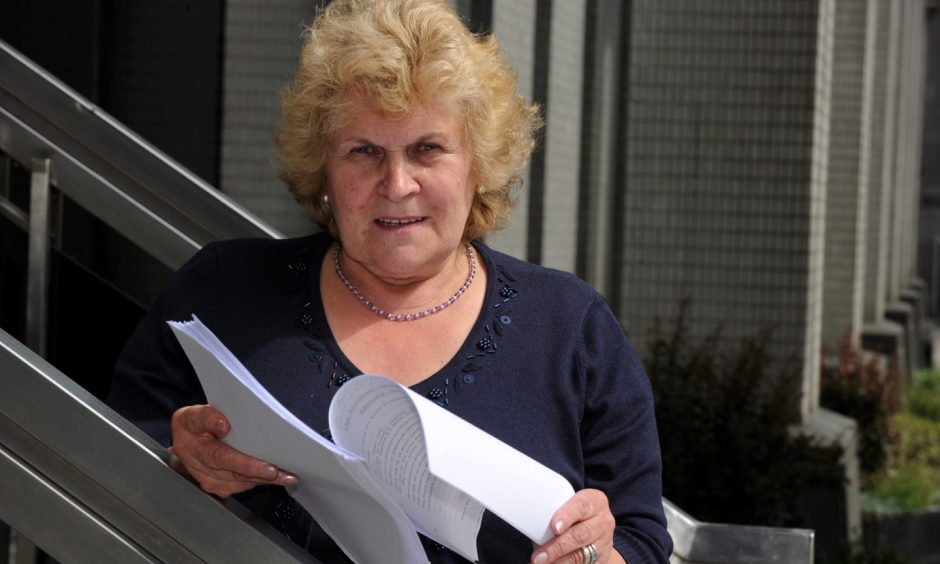 Jeannie Ritchie with the report, at Aberdeen Town House for the inquiry into the sinking of the Trident fishing boat in 1974. Image: Kenny Elrick/ DC Thomson