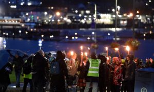 Hundreds of people have taken part in a torchlight procession tonight in the pouring rain. Image: Sandy McCook/DC Thomson