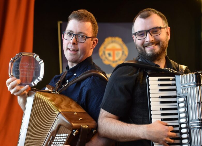 Graham MacLennan of Stornoway, winner of the Smith Mearns trophy in the adult accordion playing with runner up Callum MacLeod of Edinburgh.