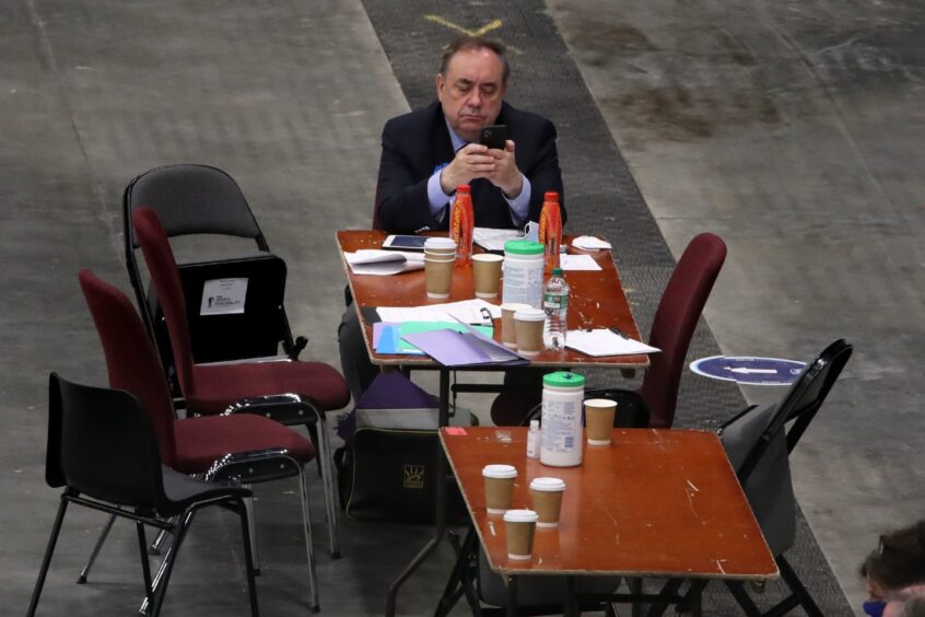 The Alba party leader on his phone as votes are being counted for the 2021 Scottish Parliamentary Elections at P&J Live.