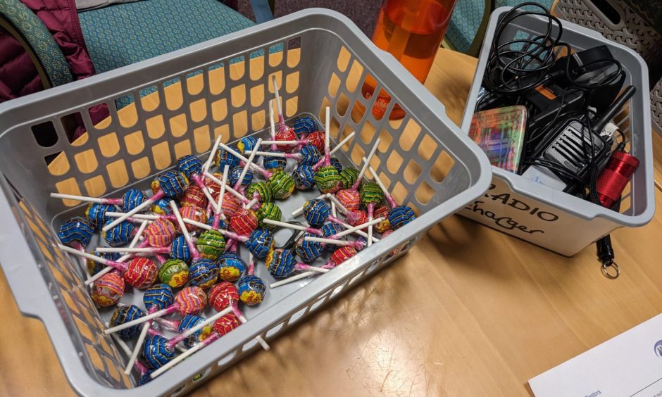 Lollipops in plastic box. 