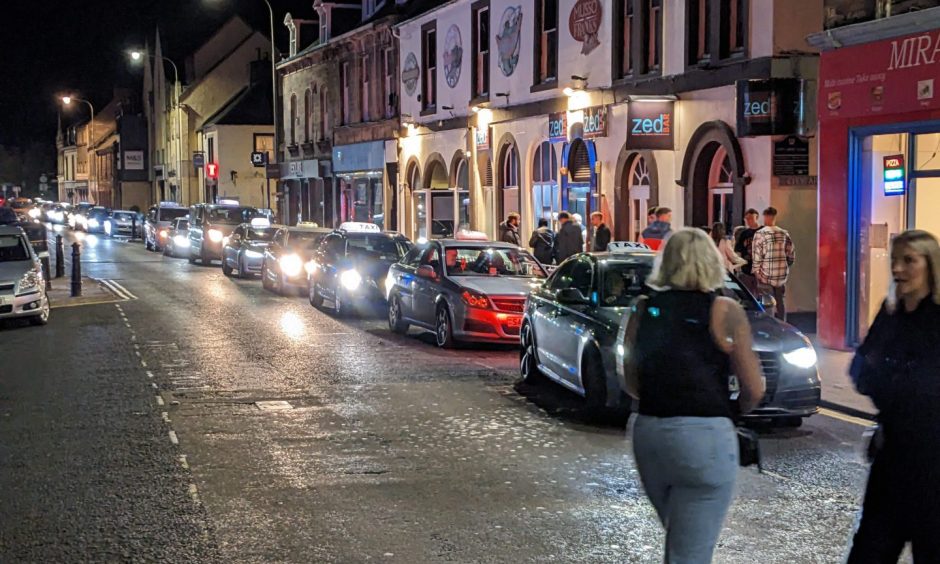 Taxis on Elgin High Street. 