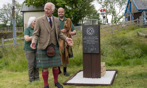 King Charles III unveils the Flow Country World Heritage Site plaque during his visit to the Forsinard Flows Visitor Centre.