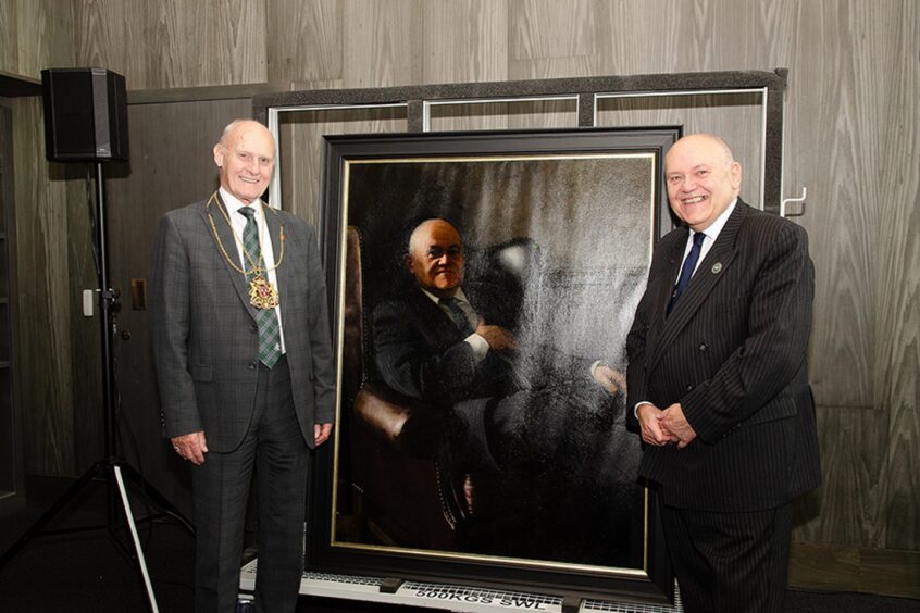 Lord Provost David Cameron smiles alongside his predecessor Barney Crockett and the newly unveiled portrait. Image: Aberdeen City Council